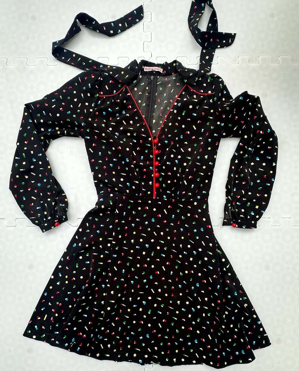 Trollied Dolly Black Novelty Print Long Sleeve Mini Dress with Red Buttons
